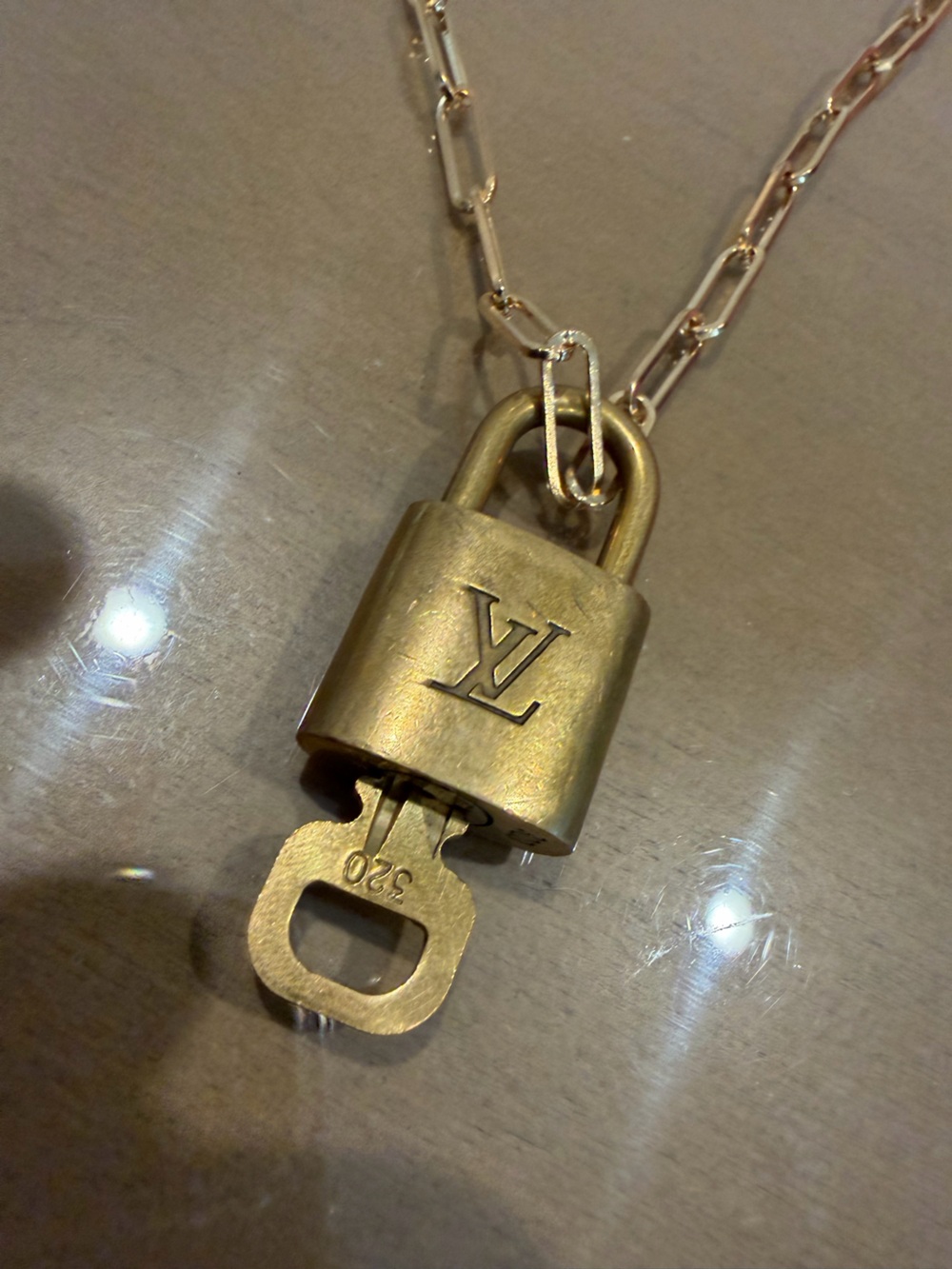 Louis Vuitton Gold Padlock with key 320